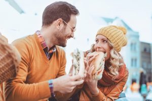 Couple with sandwiches from Greggs